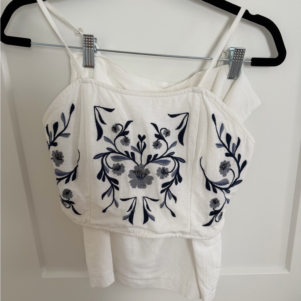 White set with navy embroidered flowers